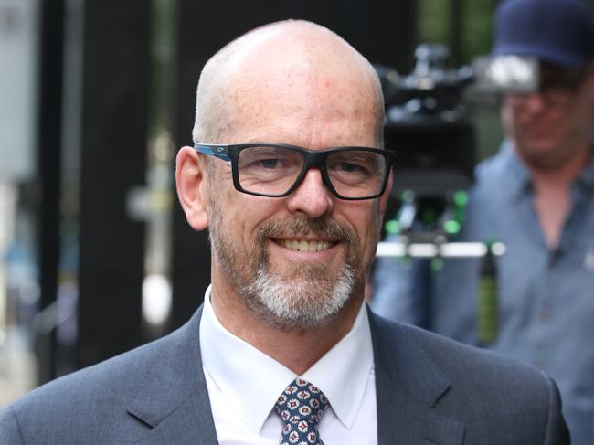 Former Victoria Police Chief Commissioner Simon Overland leaves the Royal Commission into the Management of Police Informants at the Fair Work Commission in Melbourne, Wednesday, December 18, 2019. (AAP Image/David Crosling) NO ARCHIVING