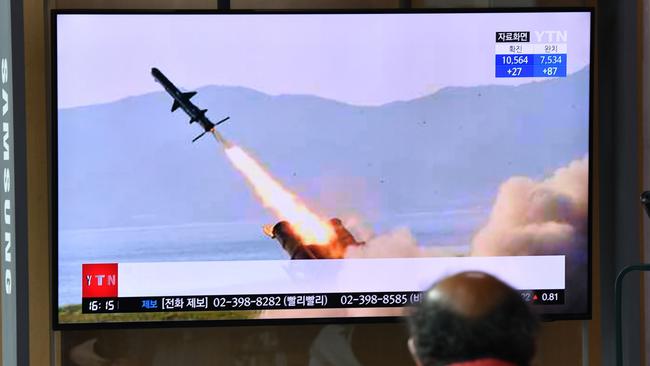 A man watches a television news broadcast showing file footage of a North Korean missile test, at a railway station in Seoul in April 2020. Picture: Jung Yeon-je/AFP