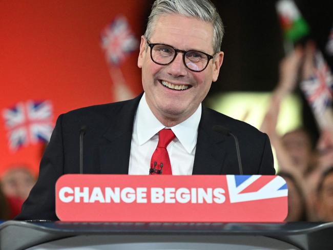 Britain's Labour Party leader Keir Starmer delivers a speech during a victory rally at the Tate Modern in London early on July 5, 2024. The UK's Labour Party swept to power after winning the country's general election, crossing the 326-seat threshold for a working majority in the House of Commons. (Photo by JUSTIN TALLIS / AFP)