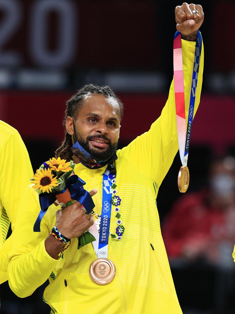 Patty Mills with his bronze medal spoils. Picture: Adam Head