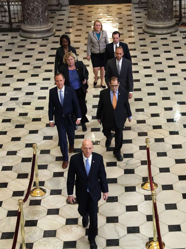 House Sergeant at Arms Paul Irving leads the seven impeachment managers into the chamber, with House Intelligence Committee Chairman to his left. Picture: AFP.