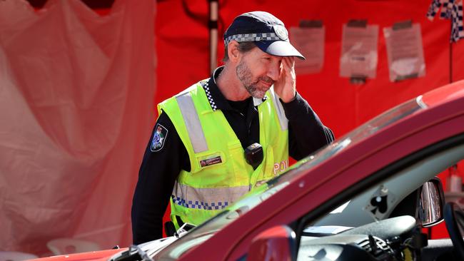 Police checking vehicles at a Queensland-NSW border checkpoint at Coolangatta. Picture: Adam Head