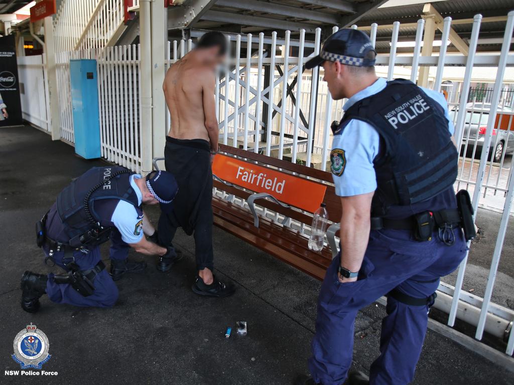 A man being searched at Fairfield train station.