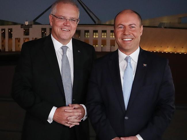 PM Scott Morrison and Treasurer Josh Frydenberg in a media scrum before appear on morning TV out the front of Parliament House in Canberra. Picture Kym Smith