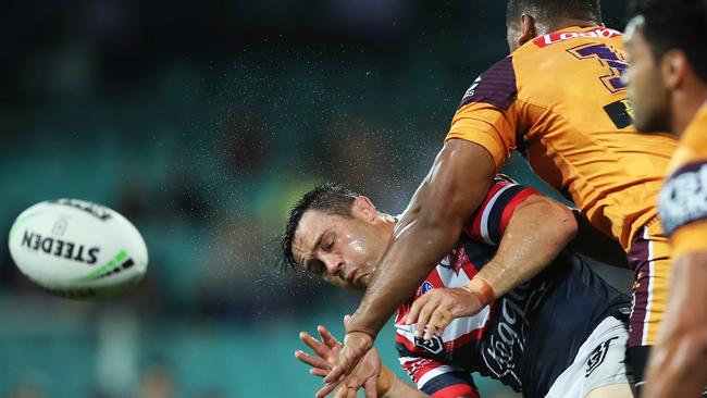 Cooper Cronk gets hit late by Tevita Pangai. Picture. Phil Hillyard