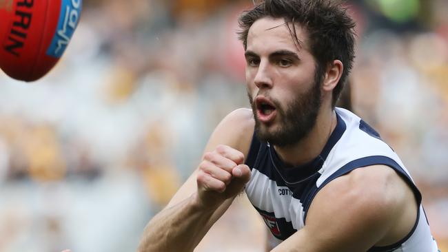 James Parsons of the Cats hand balls during the Round 21 AFL match between the Hawthorn Hawks and the Geelong Cats at the MCG in Melbourne, Saturday, August 11, 2018. (AAP Image/David Crosling) NO ARCHIVING, EDITORIAL USE ONLY