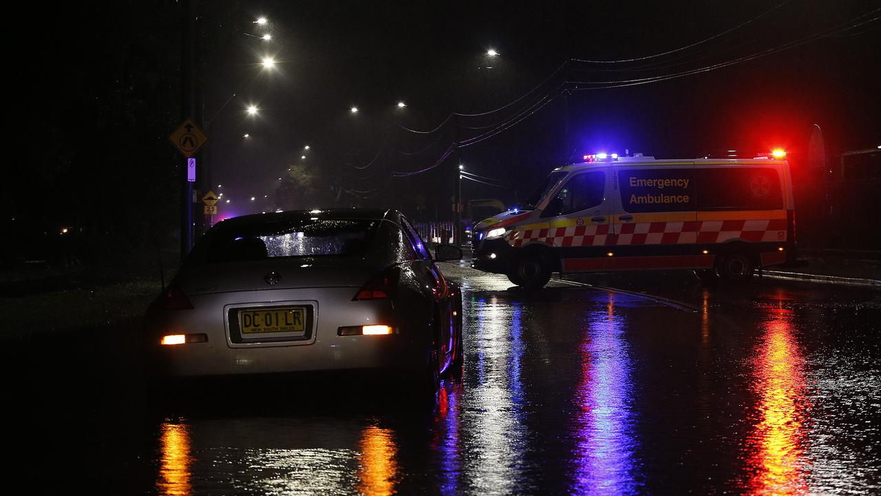 A car that was swamped by rising flood waters in Canley Vale as heavy rain causes flooding across Sydney. Picture: John Appleyard