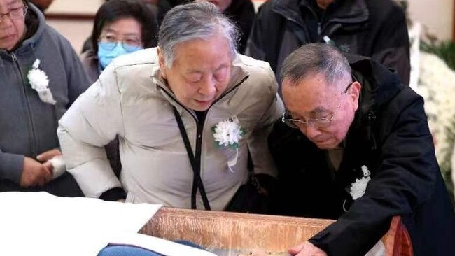 Zhu Ling's mother Zhu Mingxin, 83 and her father Wu Chengzhi, 84 at her funeral on December 24, 2023.