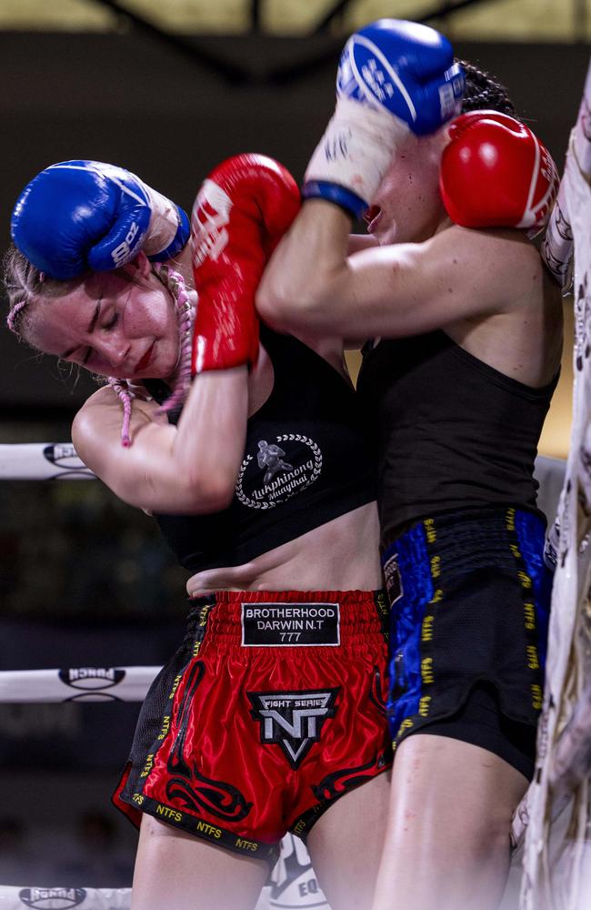 Taleisha Kirk (red) vs. Claire Russell (blue) at the NT Fight Series XI at Ventia Stadium. Picture: Pema Tamang Pakhrin