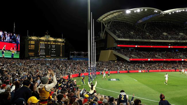 Adelaide fans celebrate a goal during the AFL Gather Round m (Image Supplied for Editorial Use only - **NO ON SALES** - Â©Phil Hillyard )