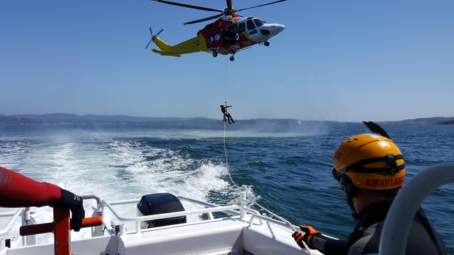 A file shot of Marine Rescue Lake Macquarie carrying out training exercises with the Hunter Westpac rescue helicopter service. Picture by Peter Lorimer.