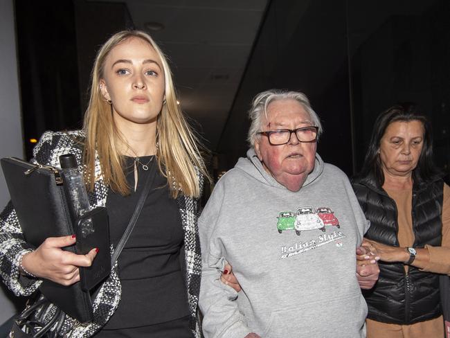 Dick Caine leaving court in June 2022 with his lawyer (left) and wife Rita (right). Picture: Daily Telegraph