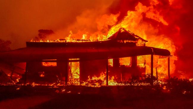 The Tutti Frutti Fruit Shop on Bells Line of Road burns, along with neighbouring houses on December 21. Picture: Matrix