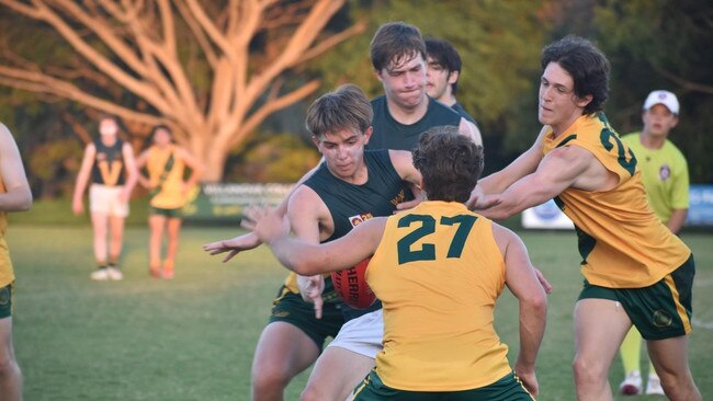 Larry Clark (far left) during the AIC AFL Footy season.