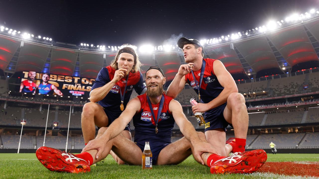 Ed Langdon, Max Gawn and Angus Brayshaw of the Demons celebrate