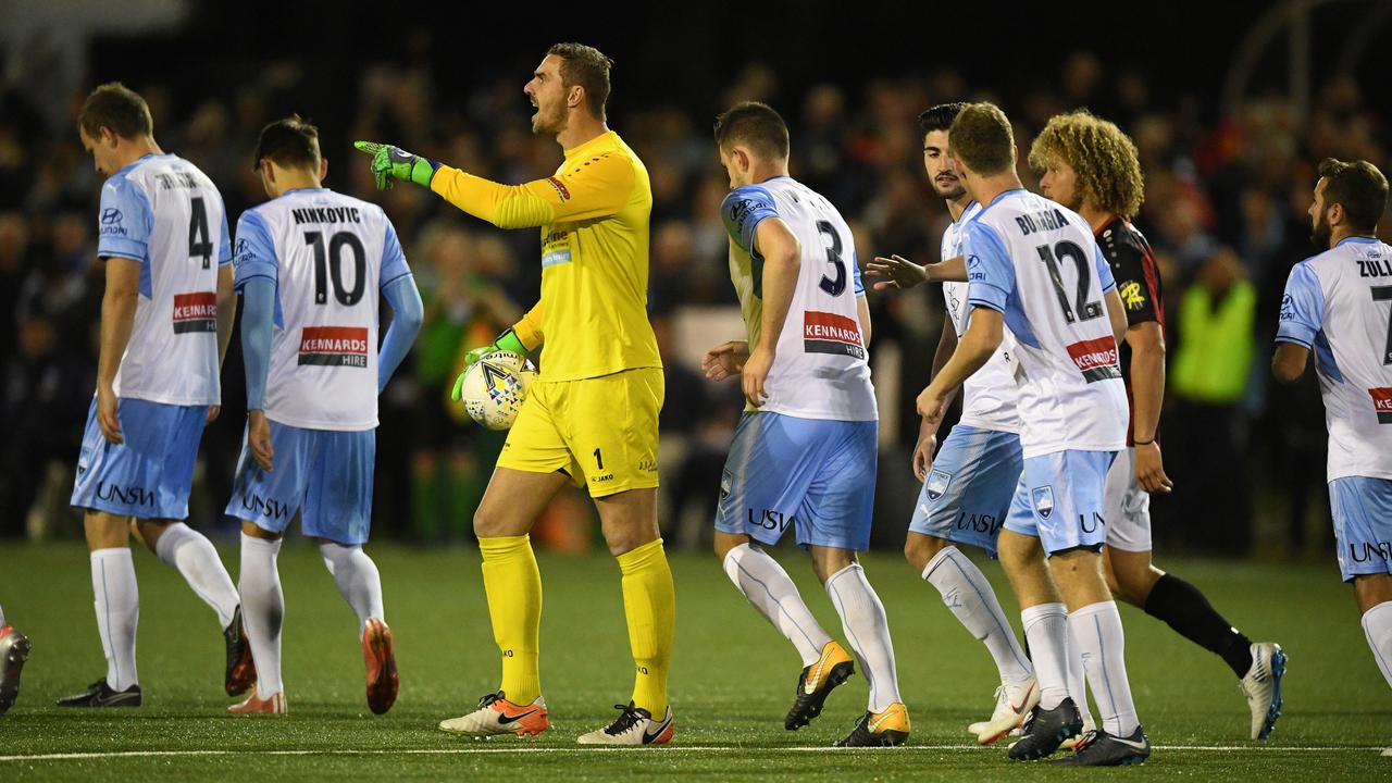 Ante Covic (left) of Rockdale reacts after a Sydney goal against Rockdale