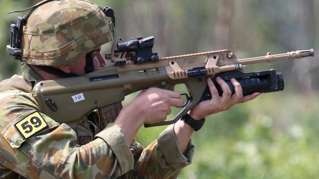 Contact ... Private Jackson Bartlett from the 5th Battalion Royal Australian Regiment pulls the trigger on the Grenade Launcher Attachment (GLA) of an EF88 Austeyr weapon at Kangaroo Flats firing range, outside of Darwin. Source: Defence