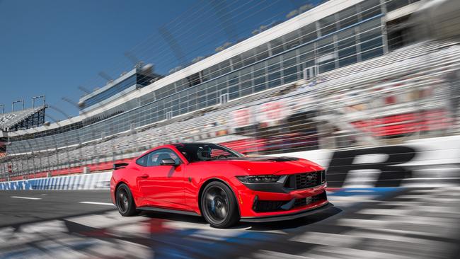 Ford Mustang showing off its 5.0-litre V8 engine on a NASCAR racetrack in the US