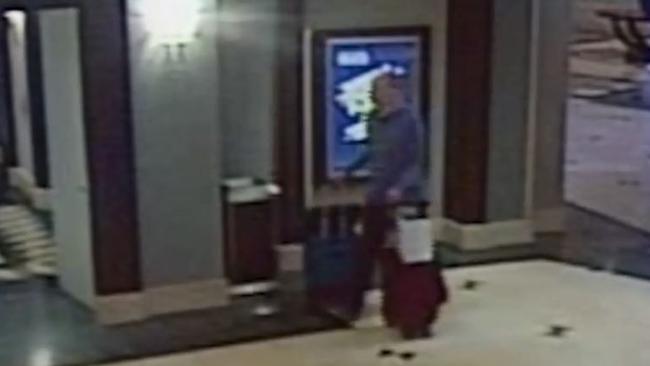 Paddock looks eerily calm as he wheels bags filled with weapons through the hotel.