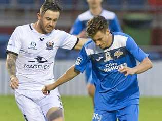 IN CONTROL: South West Queensland Thunder defender Wade Hall shields the ball from his Magpies Crusaders FC opponent. Picture: Kevin Farmer