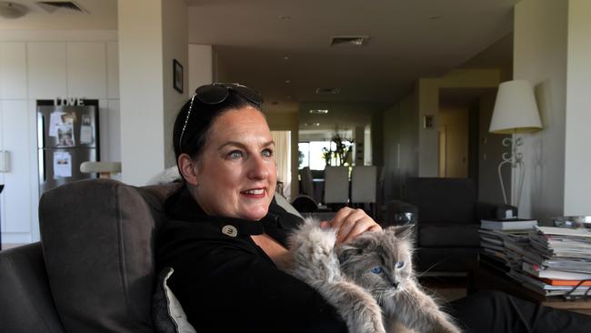 Drunk driver survivor Kirstey Whicker at home with her cat Nelson. Picture: Tricia Watkinson