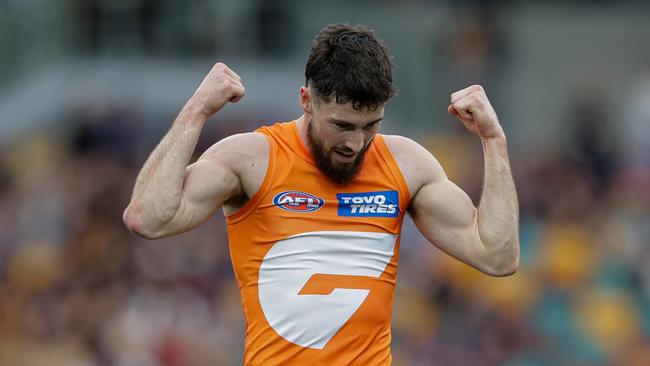 BRISBANE, AUSTRALIA - AUG 11: Lachie Ash of the Giants celebrates during the 2024 AFL Round 22 match between the Brisbane Lions and the GWS GIANTS at The Gabba on August 11, 2024 in Brisbane, Australia. (Photo by Russell Freeman/AFL Photos via Getty Images)