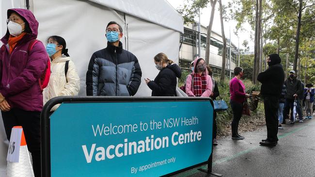 Queues of people lining up to get the Covid-19 Vaccine at the Olympic Park Vaccination Hub in Sydney. Picture: NCA NewsWire / Gaye Gerard