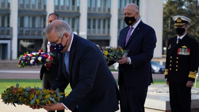 Scott Morrison and Defence Minister Peter Dutton lay wreaths at the American-Australian Memorial in Canberra on Wednesday. Picture: Adam Taylor