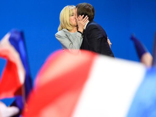 Emmanuel Macron kisses his wife Brigitte during the Presidential election last year. Picture: Eric Feferberg/AFP