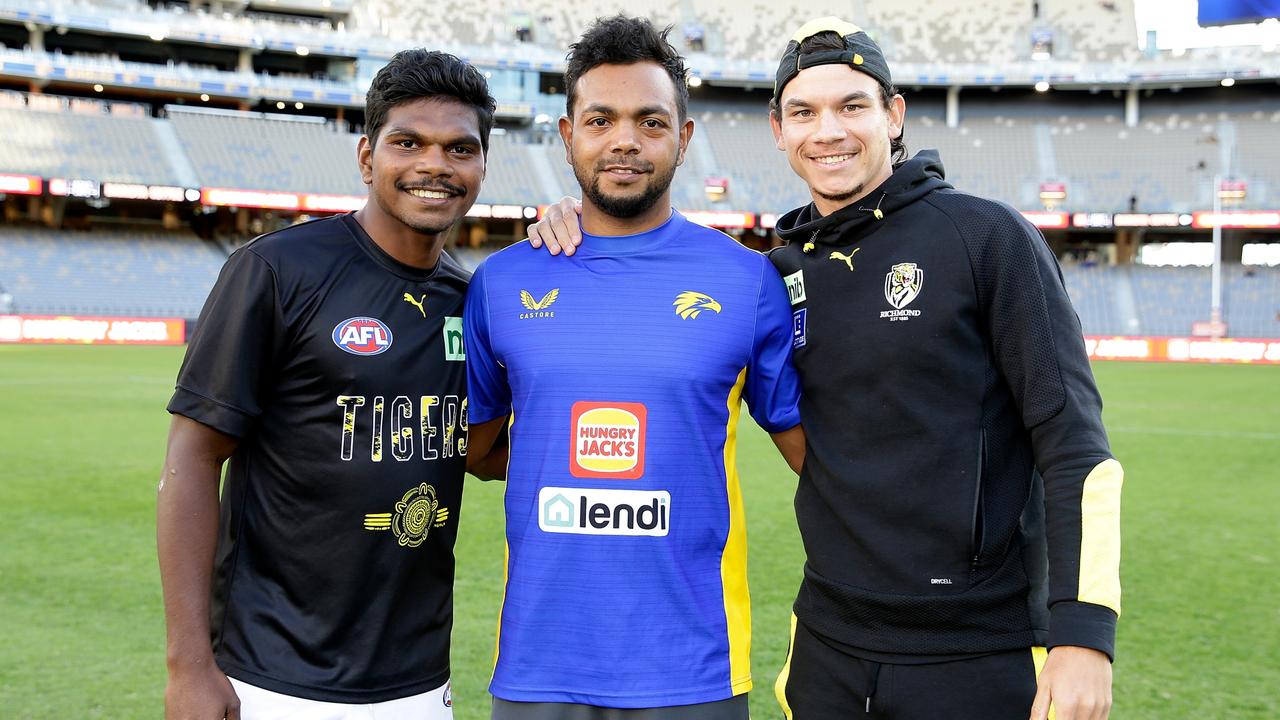 PERTH, AUSTRALIA - APRIL 29: Maurice Rioli, Daniel Rioli of the Tigers and Willie Rioli of the Eagles pose for a photo during the 2022 AFL Round 07 match between the West Coast Eagles and the Richmond Tigers at Optus Stadium on April 29, 2022 in Perth, Australia. (Photo by Will Russell/AFL Photos via Getty Images)