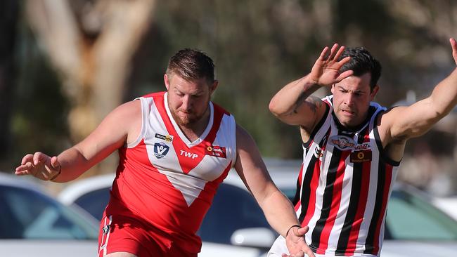 Danny Brewster, left, playing for Elmore in the Heathcote District league. Picture: Yuri Kouzmin