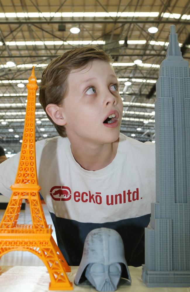 Jasper Johnstone, 8, from Highland Park with 3D printed buildings by GC Techspace. Picture: Glenn Hampson