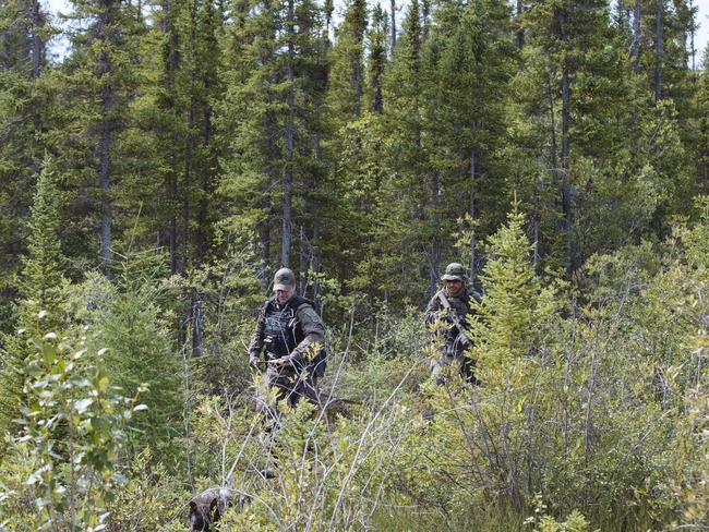 RCMP Emergency Response Team in the area near where a burnt-out Toyota Rav 4 driven by the murder suspects was found near Gillam, Manitoba, Canada. Picture: Angus Mordant for News Corp Australia