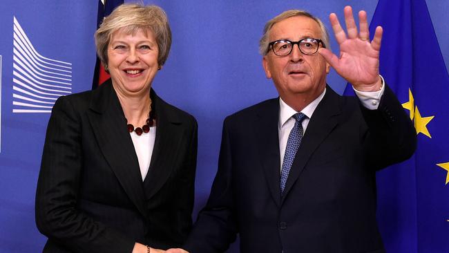 EU Commission President Jean-Claude Juncker, right, with British Prime Minister Theresa May. Picture: AFP