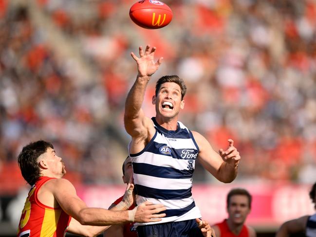 Tom Hawkins palms the ball down. Picture: Matt Roberts/AFL Photos/Getty Images