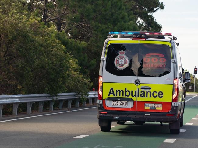 Man in 20s rushed to hospital after Burnett Highway rollover