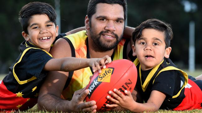 Max Solomon, the first country footballer to kick 100 goals for the season, with his two boys, Max jnr, 8, and Jararah, 6. Picture: Kylie Else