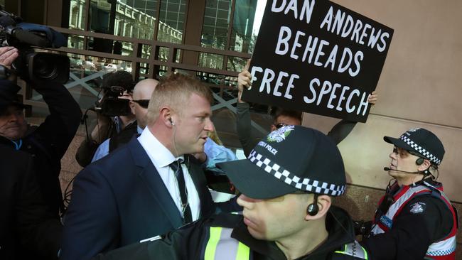 Blair Cottrell arrives at court as protesters stop traffic outside. Picture: David Crosling