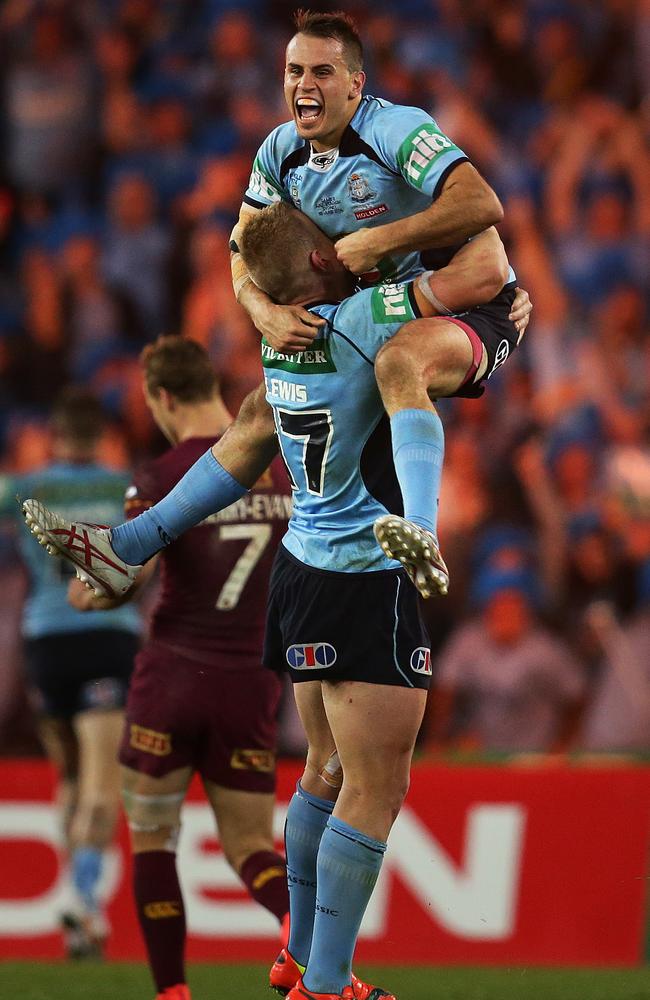 NSW's Josh Reynolds celebrates victory for the Blues with Luke Lewis during game two of State of Origin.