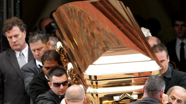 Carl Williams’ gold coffin leaves his funeral service. Picture: Stuart Mcevoy