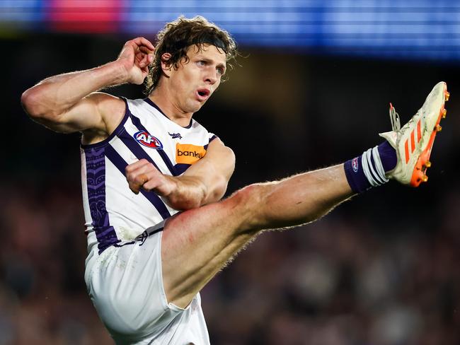 MELBOURNE, AUSTRALIA - JULY 01: Nat Fyfe of the Dockers kicks the ball during the 2023 AFL Round 16 match between the Western Bulldogs and the Fremantle Dockers at Marvel Stadium on July 1, 2023 in Melbourne, Australia. (Photo by Dylan Burns/AFL Photos via Getty Images)