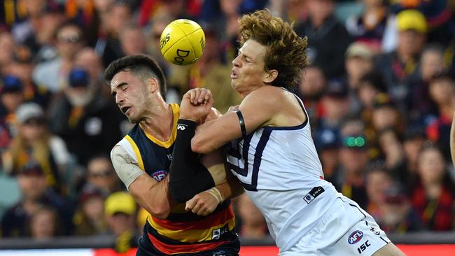 Lachlan Murphy disposses Nat Fyfe with a bump. Picture: AAP