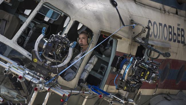 Florence Pugh on set in the old Soviet helicopter.