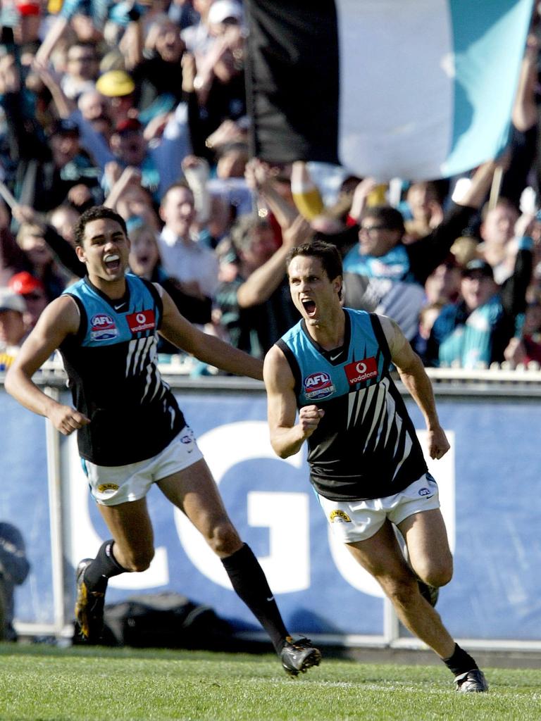 Shaun Burgoyne and Wanganeen celebrate one of his four goals.