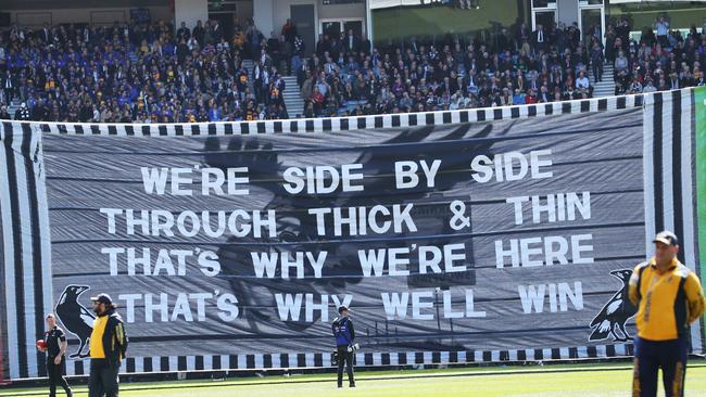 The Collingwood banner before it ripped. Picture. Phil Hillyard