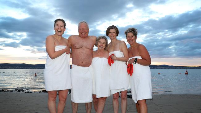 2018 Dark Mofo Nude Swim at Long Beach Sandy Bay. Bronwen Puleston-Jones of South Hobart, left, Harald and Lee Gatenby of Mountain River, Lynette Litster, of Allens Rivulet and Jane Richardson of Sandy Bay after the swim. Picture: SAM ROSEWARNE