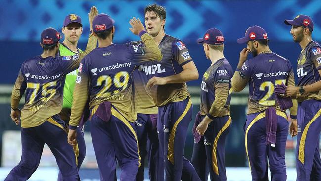 Aussie quick Pat Cummins celebrates a wicket with his IPL teammates.