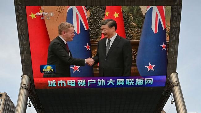 An outdoor screen shows news coverage of New Zealand's Prime Minister Chris Hipkins meeting with China's President Xi Jinping at the Great Hall of the People. Picture: AFP