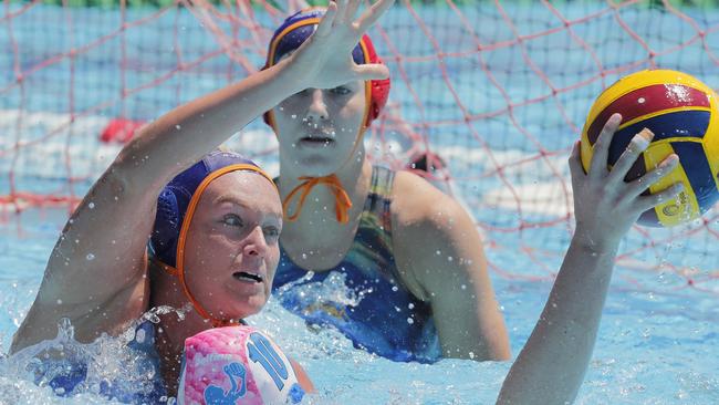 Sam Firrell (left) of Gold Coast challenges Pippa Pedley of Mermaids during the womenÃs competition in the Defina Queensland Premier League Water Polo held at the Southport Aquatic Centre, Gold Coast, October 15, 2023. Photo: Regi Varghese