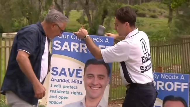 Eddy Sarroff and son Edward on the campaign trail. Pic by Seven News Gold Coast.